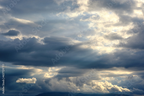 Cloudscape dramatic background, sunset light © Frostroomhead
