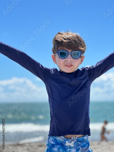 boy wearing goggles in the beach in south florida cocoa beach 