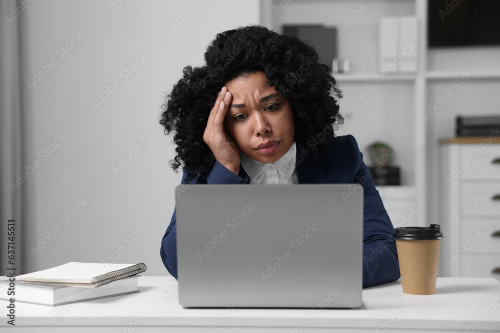 Deadline concept. Stressed woman working with laptop in office