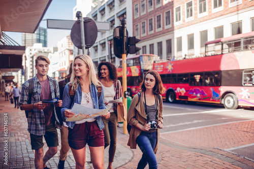 Young and diverse group of young people on a vacation traveling and exploring the city together