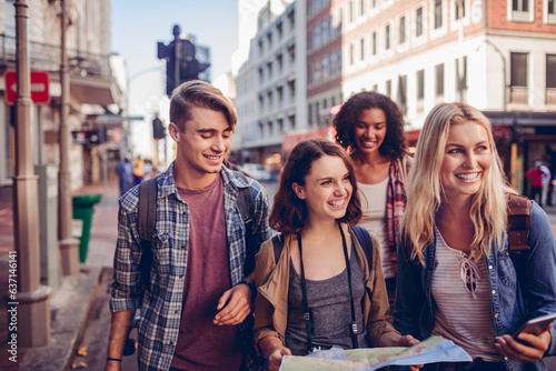 Young and diverse group of young people on a vacation traveling and exploring the city together