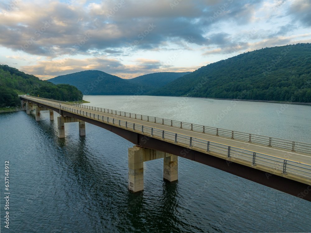 Late afternoon summer aerial photo of the bridge over the Cannonsville Reservoir, Trout Creek, Route 10.