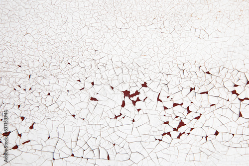 Cracked White Paint on Rusted Surface