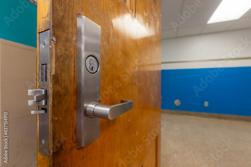 Open classroom door with new door hardware with security locks for a lockdown.