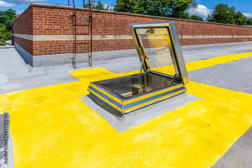 Bilde på lerret Roof hatch for access to roof with a built in skylight on a spray foam roof with