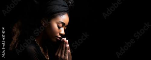 Soulful Devotion: Christian Woman in Prayer - Embracing Faith on a Reverent Black Canvas.