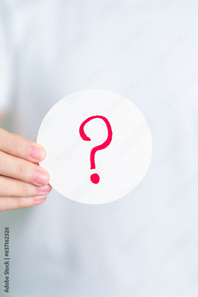 Woman show Questions Mark ( ? ) on paper. FAQ, frequency asked questions, Answer, Q and A, Information, Communication and interrogation Concepts Woman show Questions Mark ( ? ) on paper. FAQ, frequency asked questions, Answer, Q and A, Information, Communication and interrogation Concepts