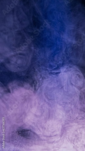 Smoke cloud. Color vapor. Spiritual aura. Purple blue neon light glitter steam wave texture abstract free space background.