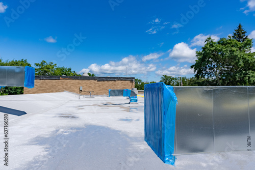 Construction of new roof mounted HVAC Ductwork waiting for new Roof Top Units, RTU.	 photo