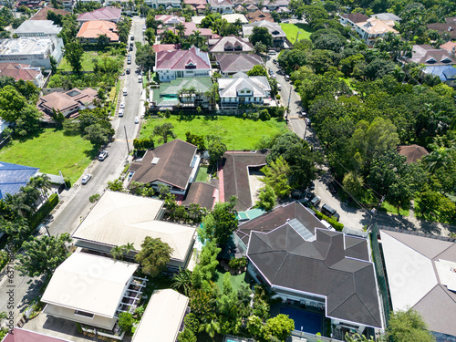 An aerial shot of a residential village in Manila, Philippines with different types of architecturally styled houses.