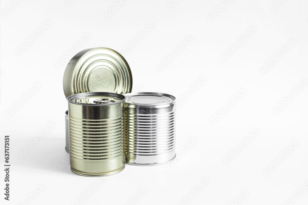 Tin cans with various products close-up on a white background. Long-term storage products. Tin cans with various products close-up on a white background. Long-term storage products.