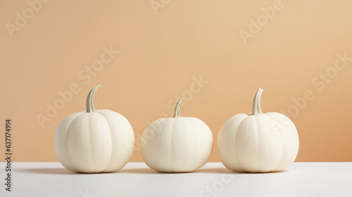 A set of elegant white pumpkins isolated on light orange pastel cream background, copy space, Canva