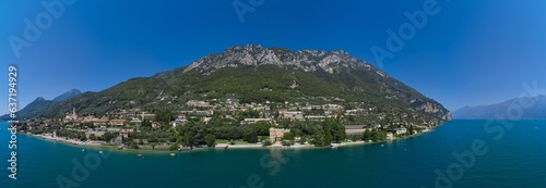 Panoramic aerial view of the city of Gargnano located on Lake Garda Italy. Coastline of the resort town of Gargnano Lake Garda Italy. photo