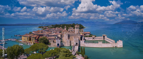 Aerial view to the town of Sirmione, popular travel destination on Lake Garda in Italy. View of the city of Sirmione. Panoramic view of Lake Garda.