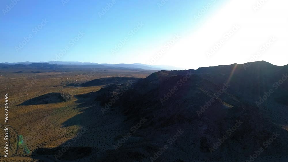 Aerial Forward Shot Of Hills And Mountains In Desert Against Sky - Mohave Desert, California Aerial Forward Shot Of Hills And Mountains In Desert Against Sky - Mohave Desert, California