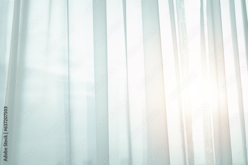 Sunlight through transparent white curtain on window into bedroom at evening summer time. Sunlight through transparent white curtain on window into bedroom at evening summer time.