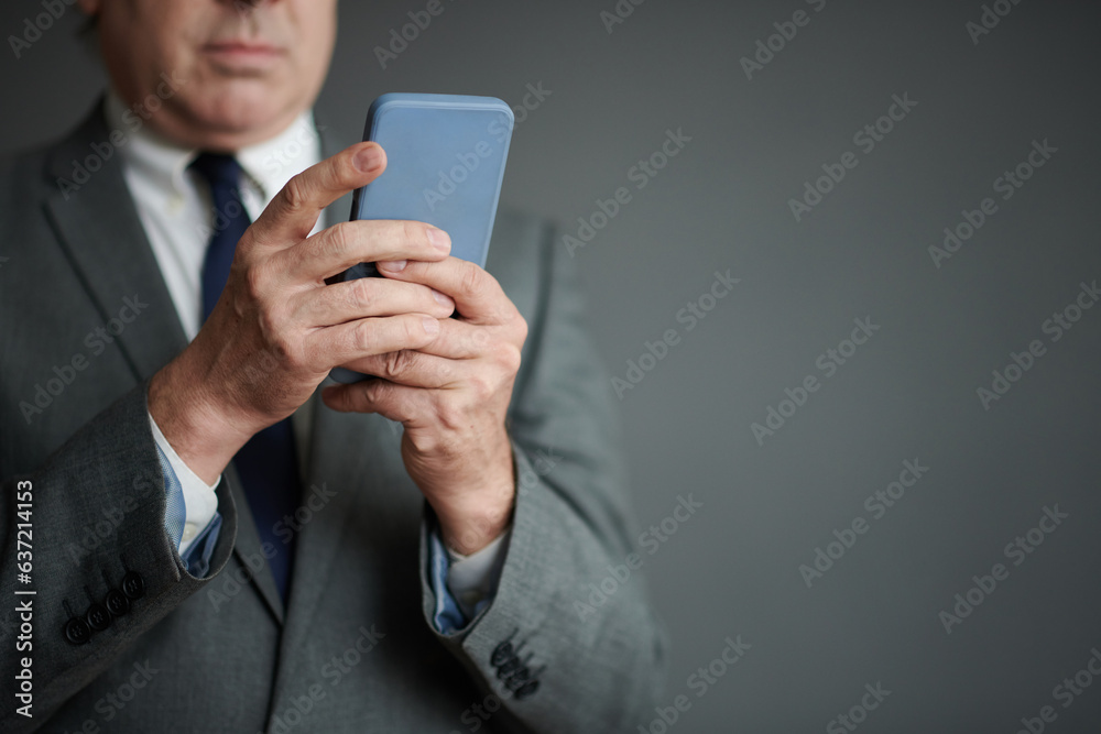 Closeup image of businessman answering text messages from colleagues Closeup image of businessman answering text messages from colleagues