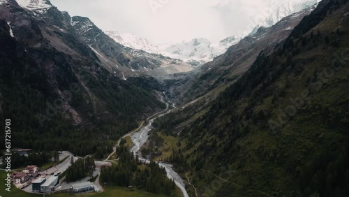 Enjoy breathtaking aerial footage captured by an drone as it glides over the impressive Alpine landscape and scenic mountain roads. Majestic beauty of the stelvio pass in the Alps in all their glory. photo