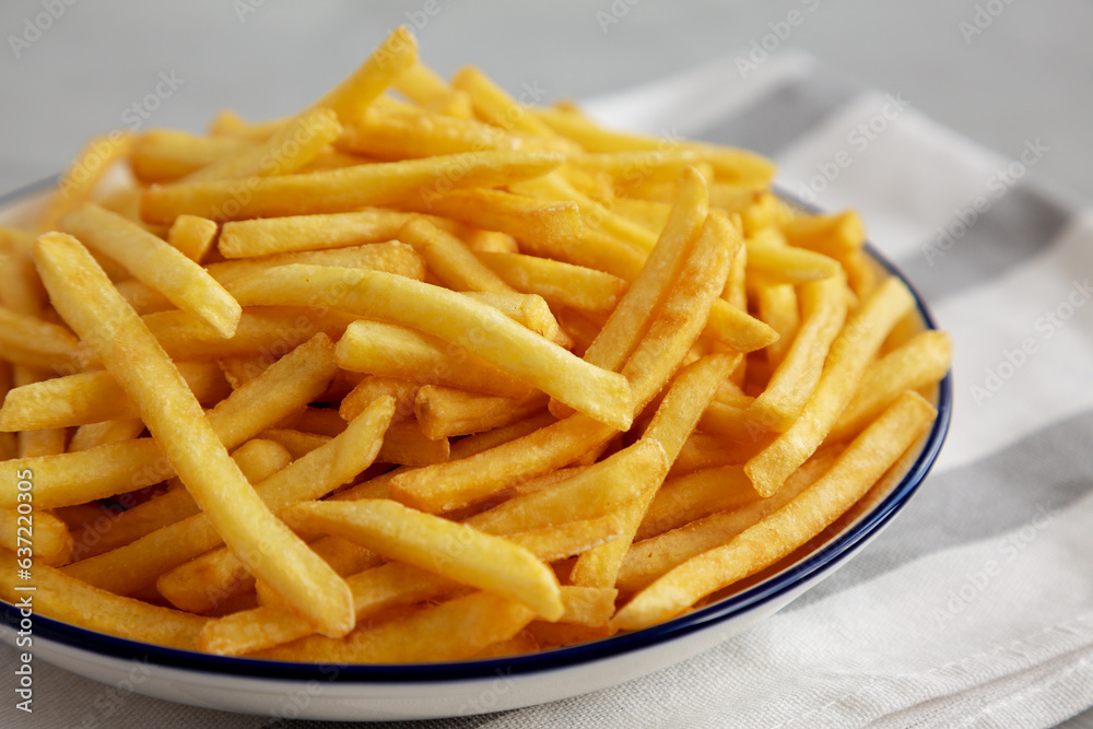 Homemade French Fries on a Plate, low angle view. Close-up. Homemade French Fries on a Plate, low angle view. Close-up.