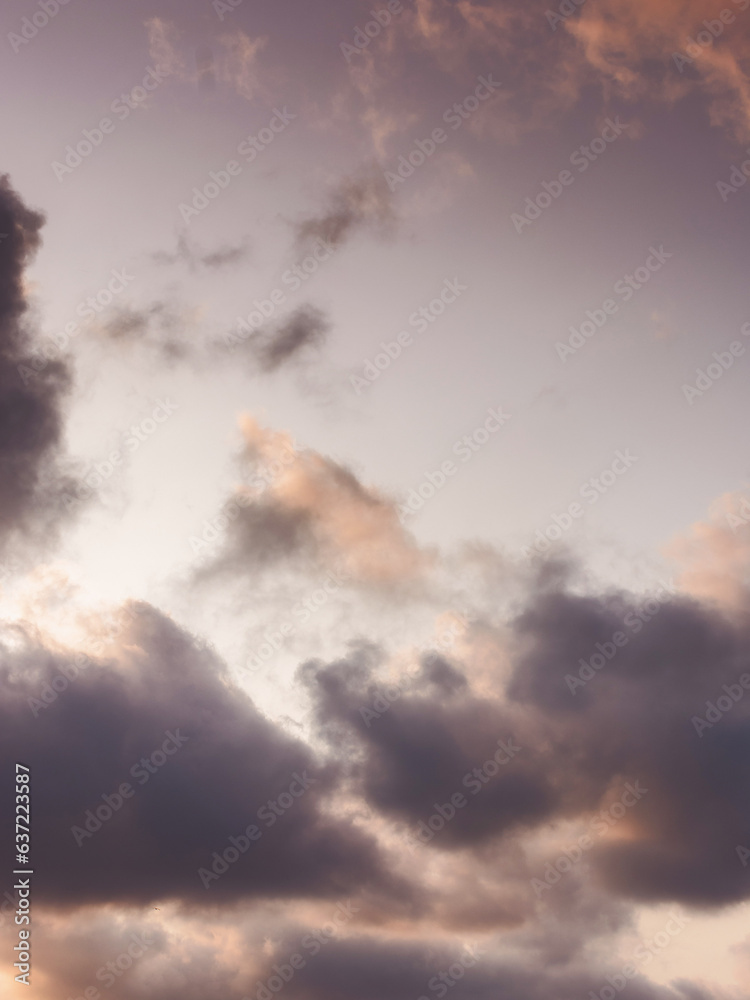 evening sky in orange glow. huge fluffy clouds. dramatic natural background