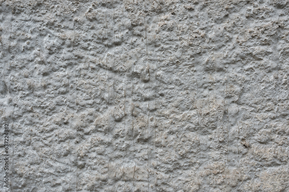 Authentic old ancient neutral beige rough plaster wall texture. Antique concrete house facade, vintage architecture building exterior detail Authentic old ancient neutral beige rough plaster wall texture. Antique concrete house facade, vintage architecture building exterior detail