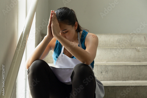 Spiritual Devotion at Work, Southeast Asian Cleaner, House Keeper, low-wage worker has a hopeful life and Praying with God, concept image for Indian Religion Belief of Hinduism and Buddhism