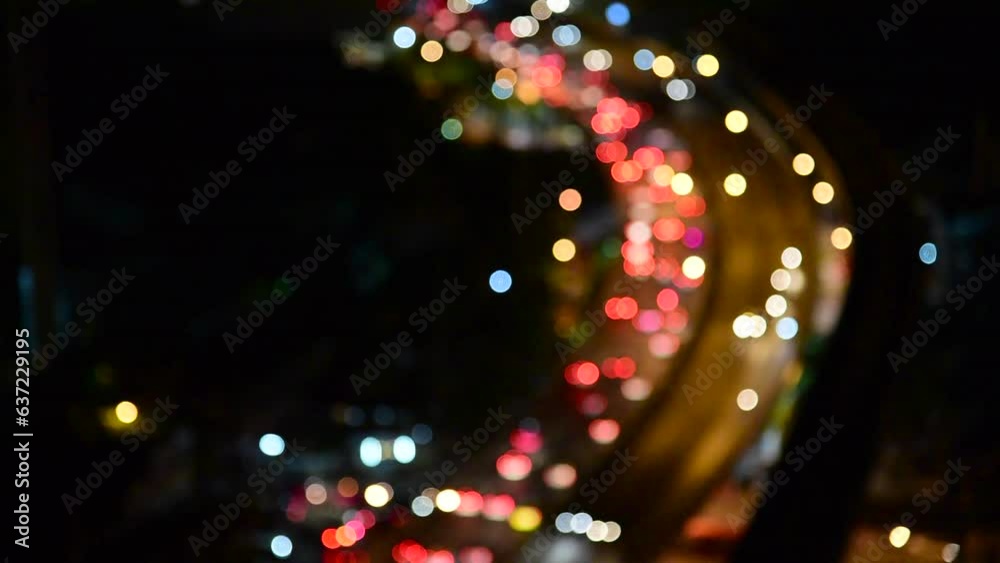 Blurred background night city bokeh car drive on road in nightlife. Light line traffic jam in black night. Blur street flare traffic motion movement. Cityscape Urban dark background twilight time