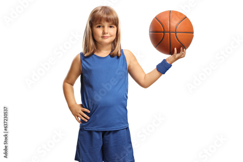 Little girl holding a basketball and smiling