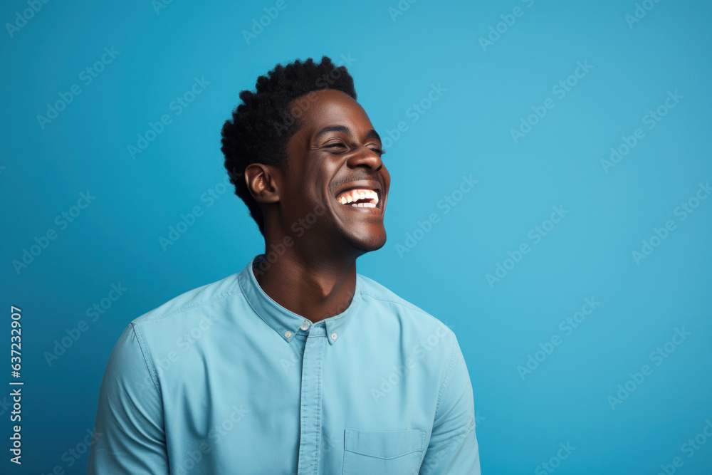 Portrait of a Man Laughing Black Man Wearing a Shirt Blue Background Happiness and Joy Portrait of a Man Laughing Black Man Wearing a Shirt Blue Background Happiness and Joy