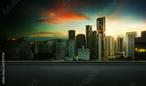 Asphalt road side with beautiful Kuala Lumpur city skyline. Sunrise scene .