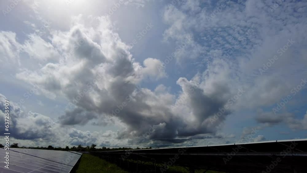 Revealing Solar Panel Arrays Against Sun and Clouds Background in Jambur Renewable Energy Power Plant, Gambia - Africa Revealing Solar Panel Arrays Against Sun and Clouds Background in Jambur Renewable Energy Power Plant, Gambia - Africa