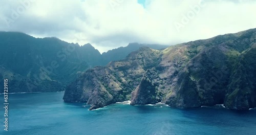 Clouds moving across lush green mountains on Fatu Hiva Island in the Marquesas Islands in tropical South Pacific French Polynesia photo