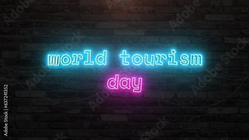 World tourism day with neon text effect in wall background. Seamless looping video