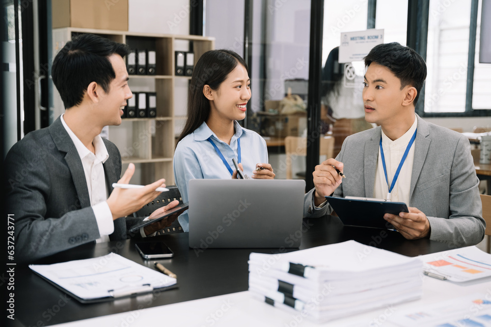 Business team to calculate financial information to invest in new projects. financial manager meeting.euing Smart phone and laptop and digital tablet PCs in office.