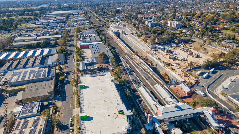 Fototapeta premium Aerial drone view of the construction site of the new metro station at St Marys in Western Sydney, NSW Australia on a sunny day in August 2023 