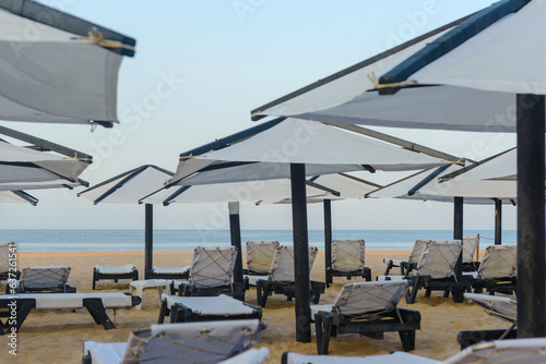 Sunbeds, Beach loungers, Relaxation, Beachside, Umbrellas,