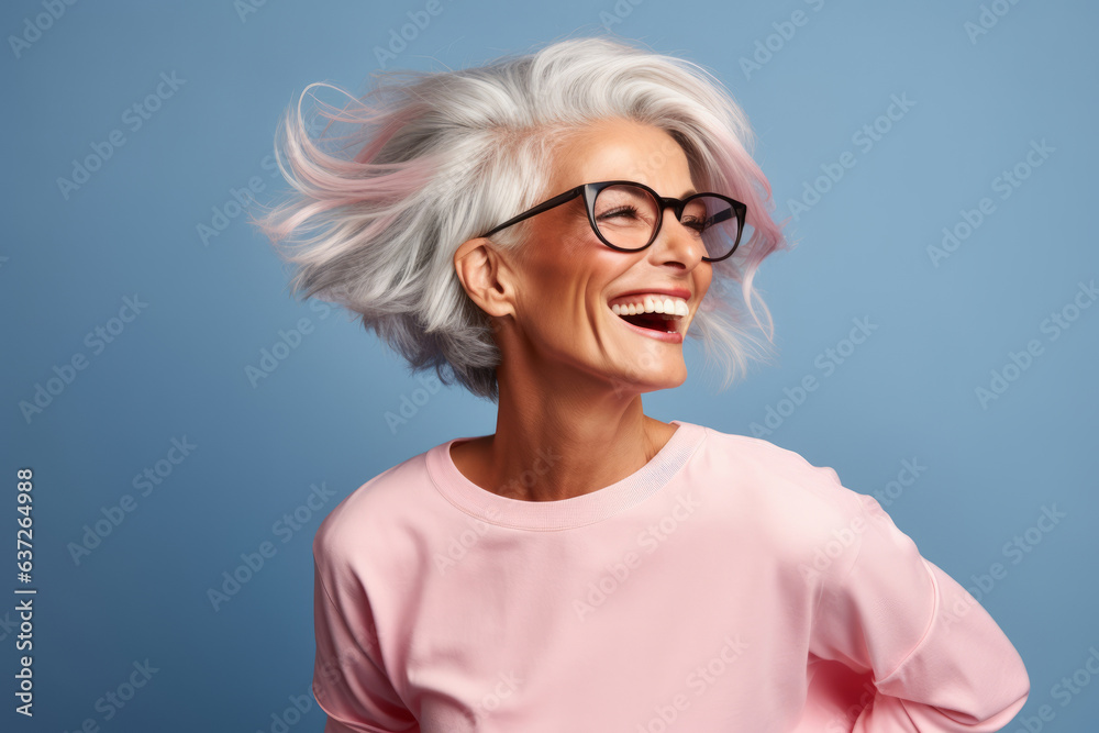 Blissful mature woman having fun in the studio
