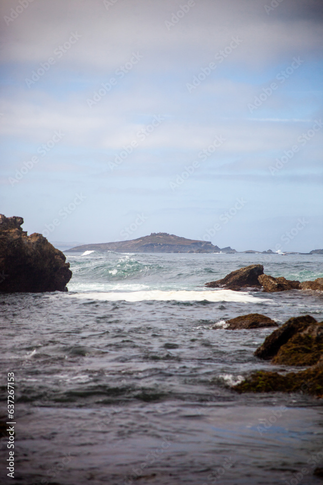 Sandy paradise at Buizinhos Beach, Porto Covo. Gaze upon the distant allure of Pessegueiro Island. Nature's beauty captured from Buizinhos shore.