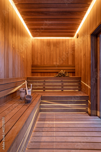 Finnish sauna interior with broom and bucket
