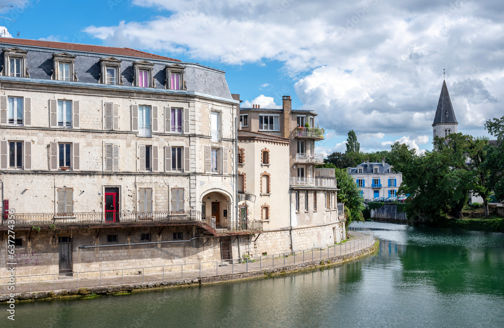 old buildings along river maas in french town of verdun