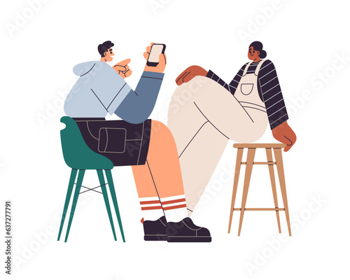 Man taking photo, mobile picture of young black woman sitting in chair, posin...