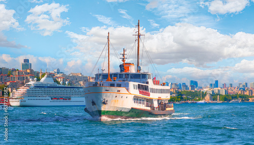 Cruise ship and ferry (steamboat) traffic in the Bosphorus - Sea voyage with old ferry (steamboat) on the Bosporus - Coastal cityscape with modern buildings under cloudy sky - Istanbul, Turkey 