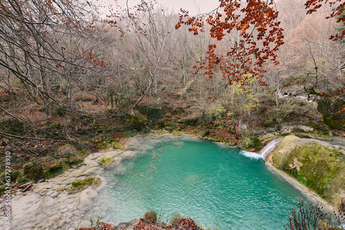 Turquoise water in the source of the Uderra River natural Park Urbasa-Andia, Baquedano, Navarre, Spain, Europe. photo