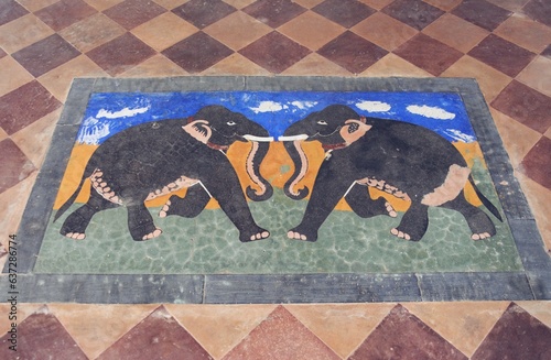 Photography design of two elephants on floor tiles