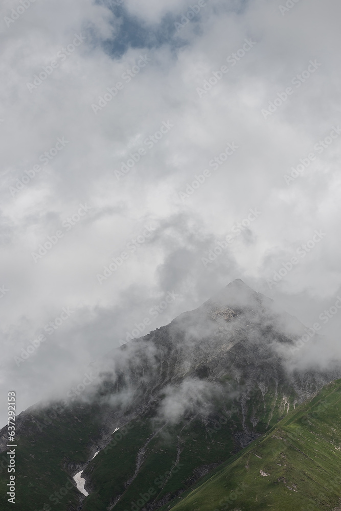 mountain landscape. clouds over peaks.