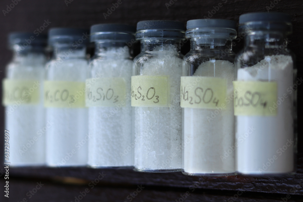 White crystalline inorganic substances - various salts in glass tubes. White crystalline inorganic substances - various salts in glass tubes.