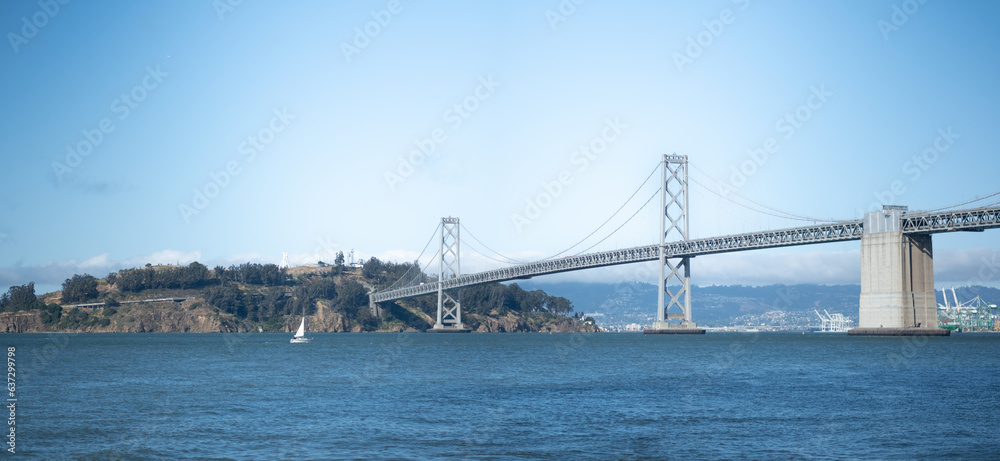 The Bay Bridge connecting San Francisco to Oakland, via Yerba Buena Island / Treasure Island. The monumental bridge is a major thoroughfare for East Bay, San Francisco, and the broader Bay Area.