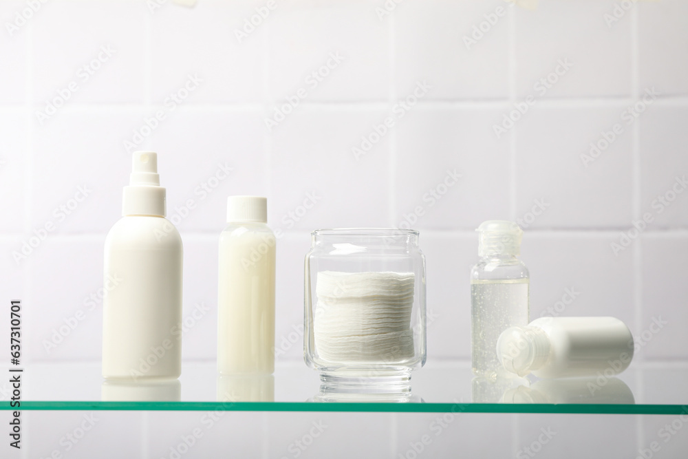 Cotton pads in a jar on the bathroom shelf. Cotton pads in a jar on the bathroom shelf.