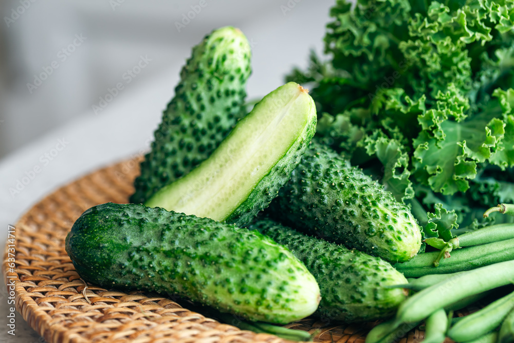Plate with cucumbers, kale, parsley and green beans, close-up. Plate with cucumbers, kale, parsley and green beans, close-up.