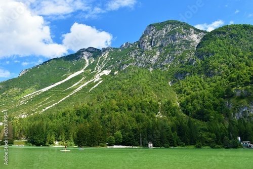 Mountain slopes above Lago del Predil near Tarvisio, Italy photo